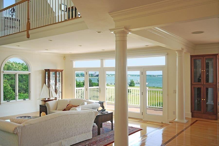13 Pine Tree Drive Buzzards Bay, MA 02532 - Photo 7 of 30 a living room with furniture and a floor to ceiling window