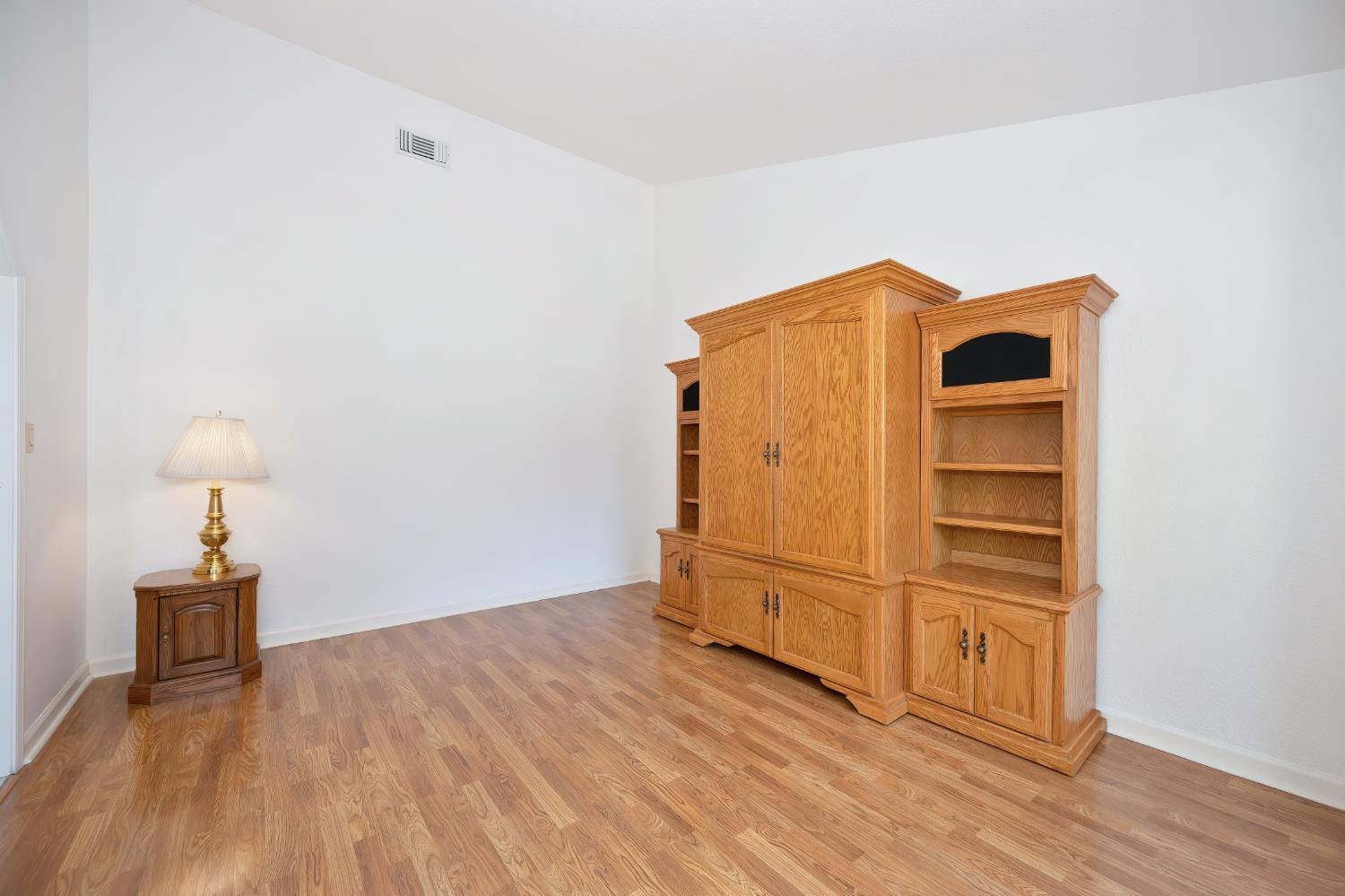 5408 East Brook Way Elk Grove, CA 95758 - Photo 13 of 53 a view of an empty room with wooden floor