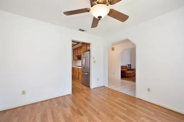 a kitchen with stainless steel appliances granite countertop a stove and cabinets