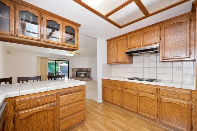a dining room with furniture and wooden floor