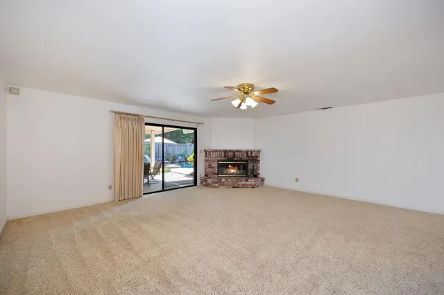a view of a kitchen with furniture and flat screen tv