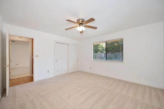 a view of a big room with carpet