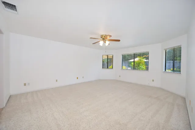 a bathroom with a double vanity sink mirror and shower