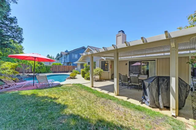 a view of a house with a yard and plants