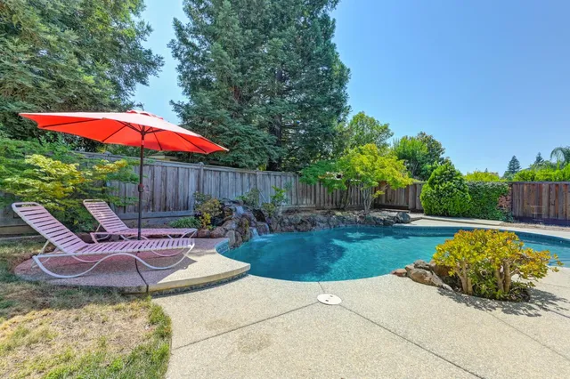 a view of a house with swimming pool