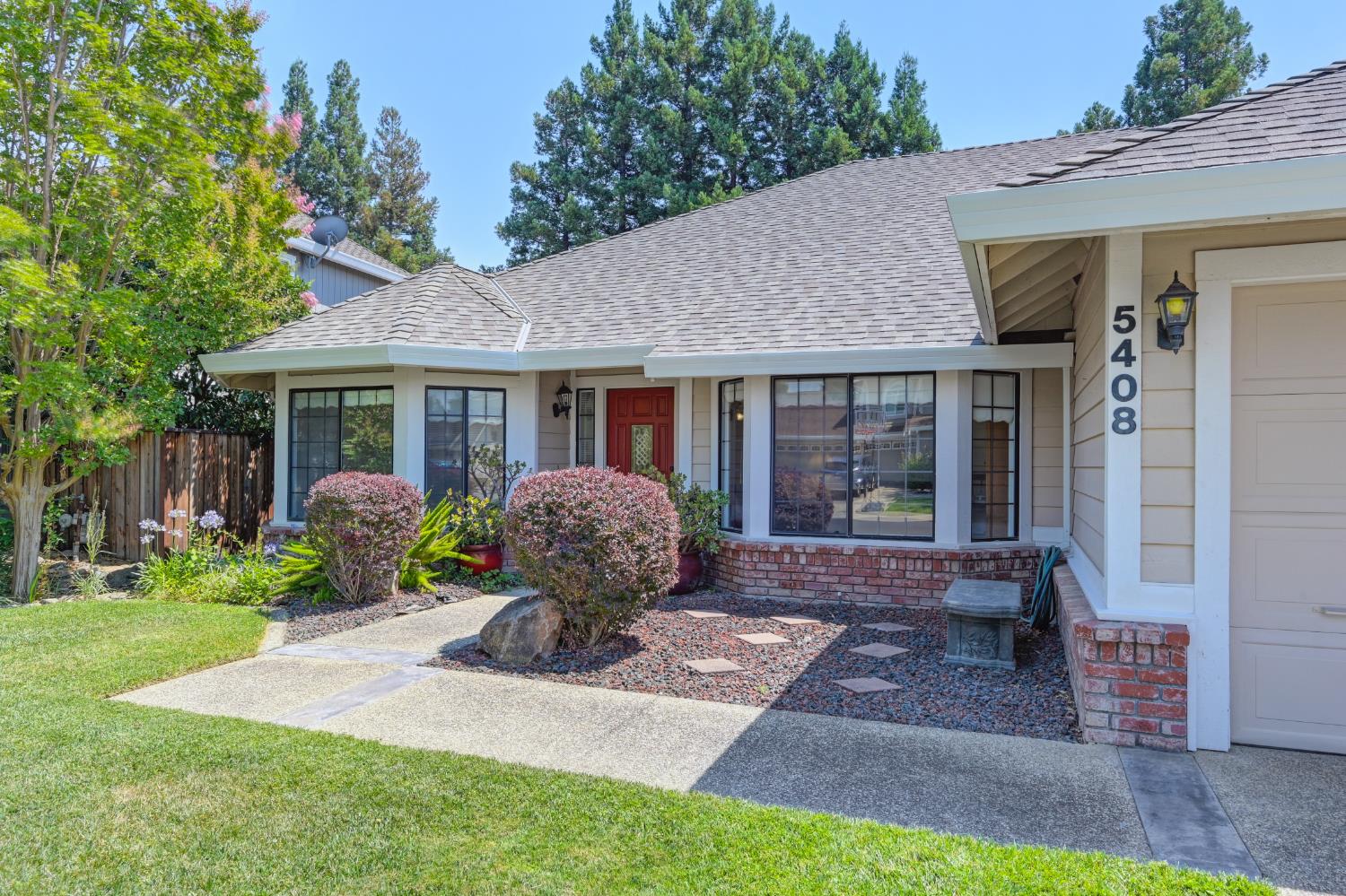 5408 East Brook Way Elk Grove, CA 95758 - Photo 8 of 53 a front view of a house with garden and porch