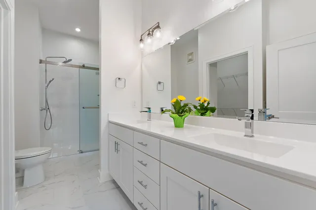 a bathroom with a glass shower door