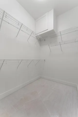 a view of an empty room with glass door