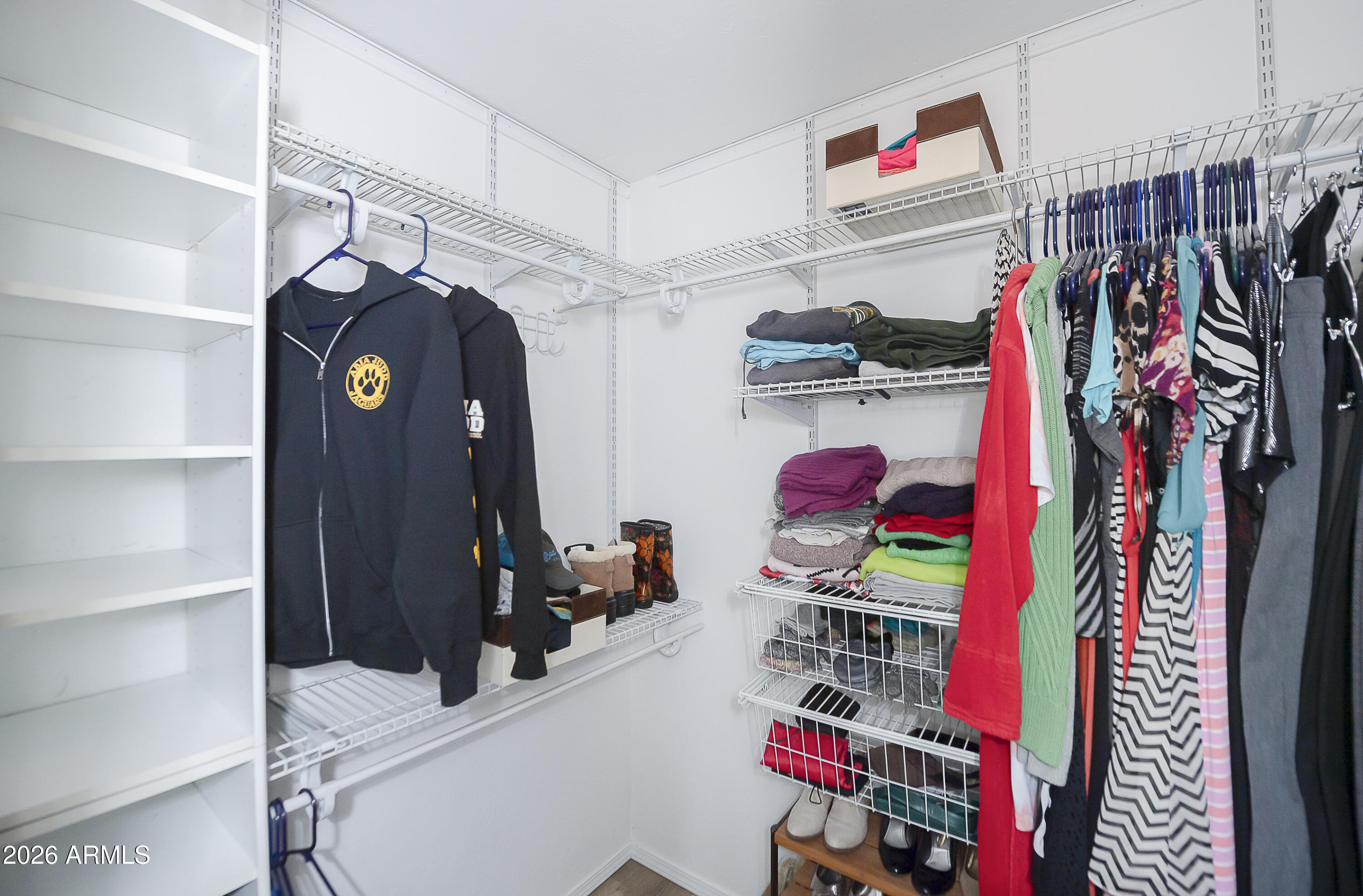6565 Musgrove Road Skull Valley, AZ 86338 - Photo 31 of 67 a view of walk in closet with clothes and shoes