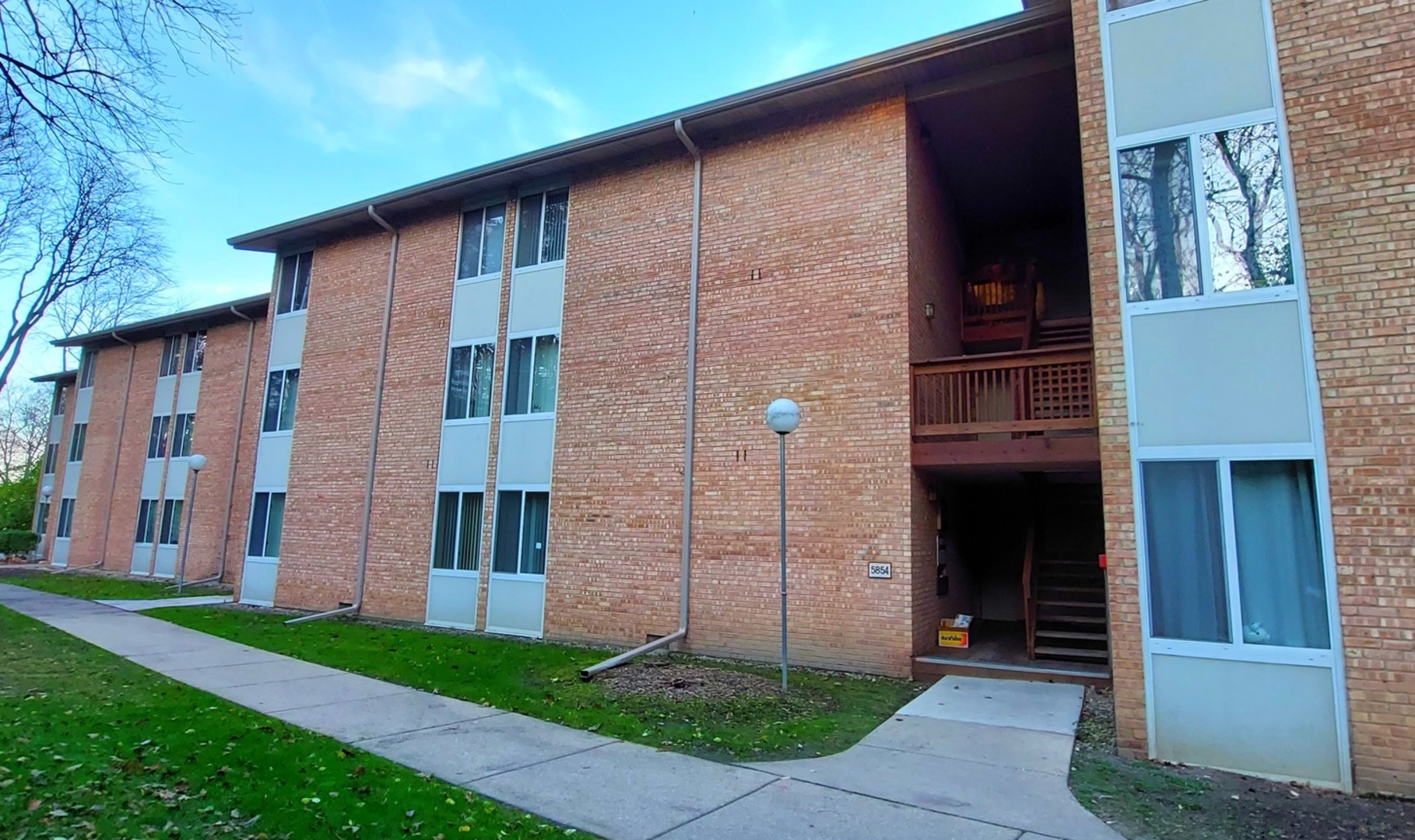 5854 Forest View Road, Unit E Lisle, IL 60532 - Photo 2 of 18 a brick building with a large windows