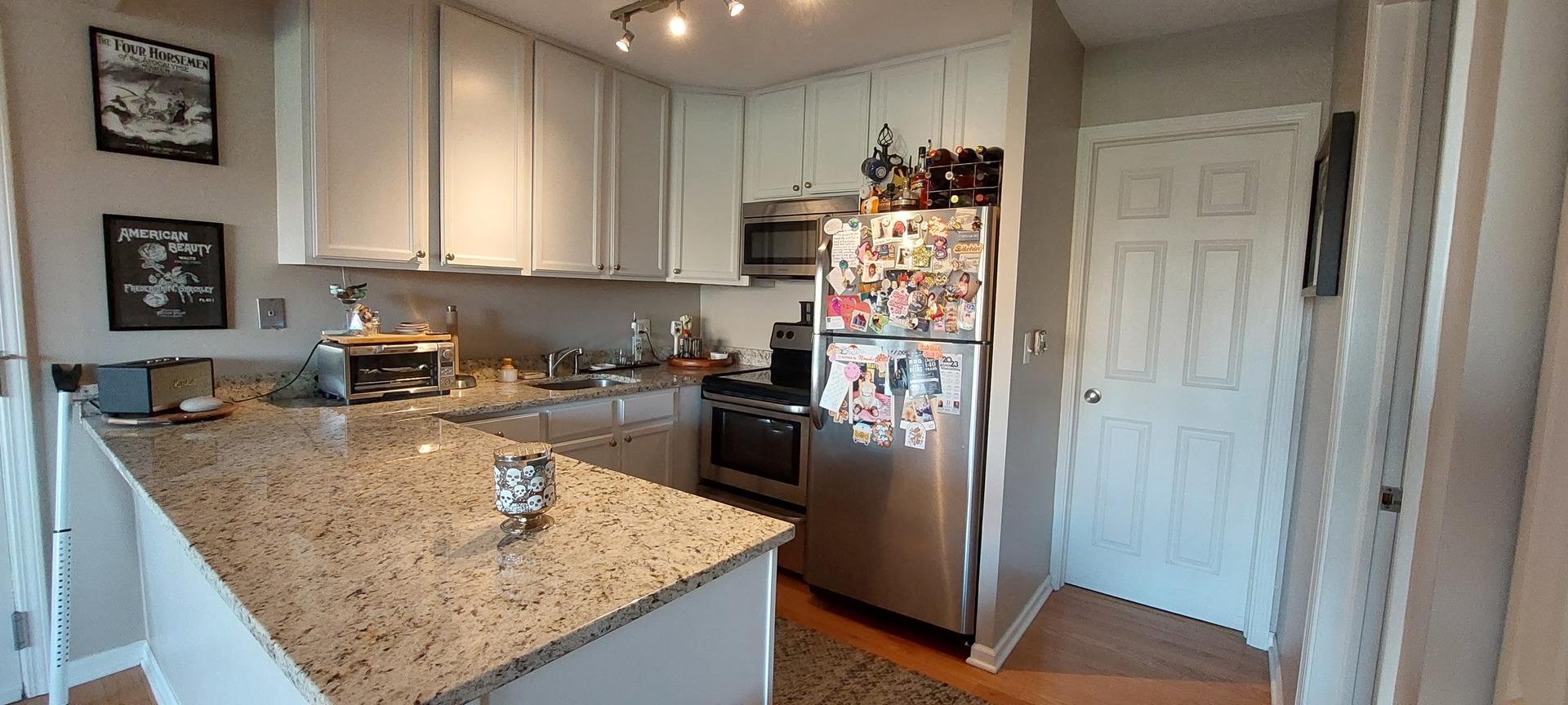 5854 Forest View Road, Unit E Lisle, IL 60532 - Photo 8 of 18 a kitchen with stainless steel appliances granite countertop a refrigerator a stove and a sink