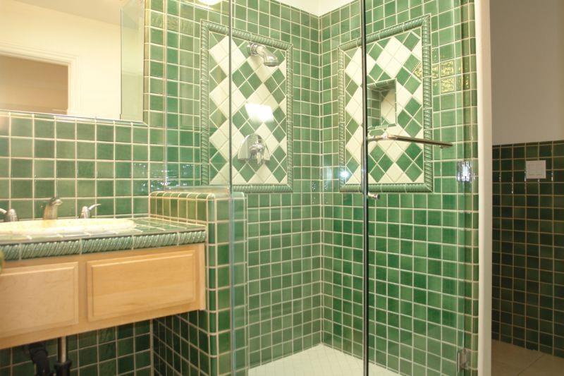 4450 Quimby Road San Jose, CA 95148 - Photo 18 of 19 a bathroom with a granite countertop shower