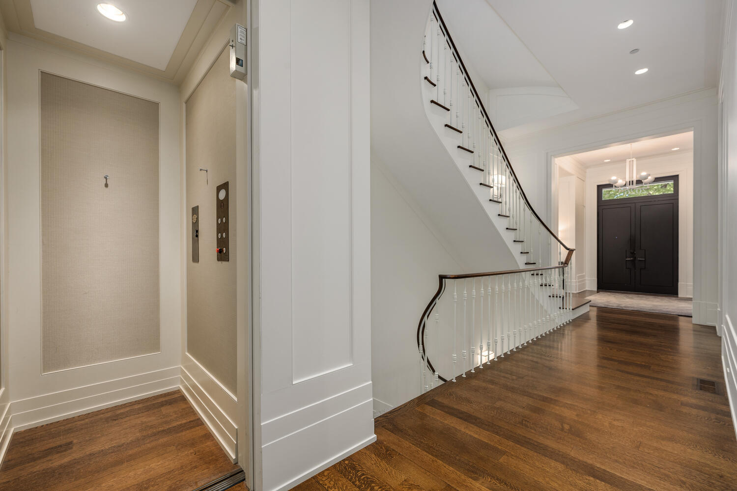 2026 North Mohawk Street Chicago, IL 60614 - Photo 20 of 56 a view of a hallway with wooden floor and staircase