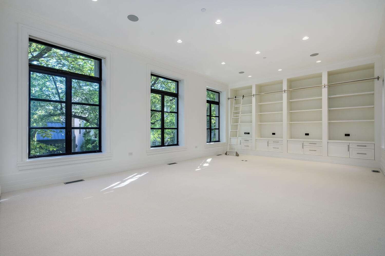 2026 North Mohawk Street Chicago, IL 60614 - Photo 41 of 56 an empty room with windows and cabinet