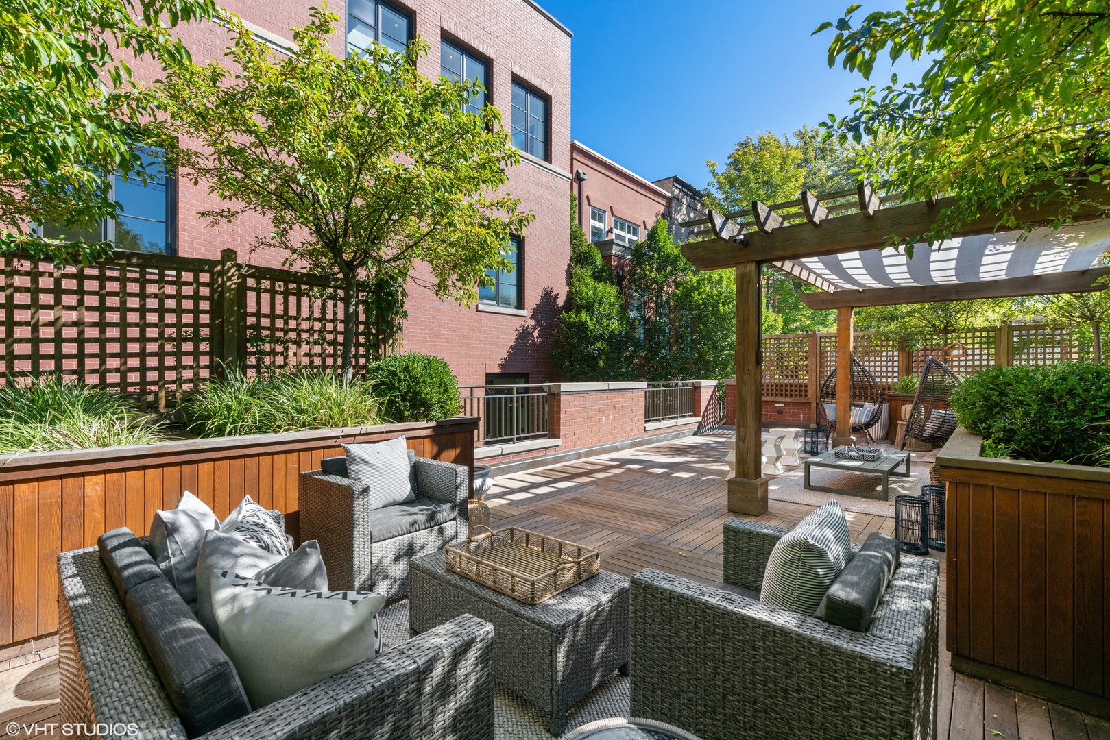 2026 North Mohawk Street Chicago, IL 60614 - Photo 53 of 56 a view of a patio with couches chairs potted plants and city view