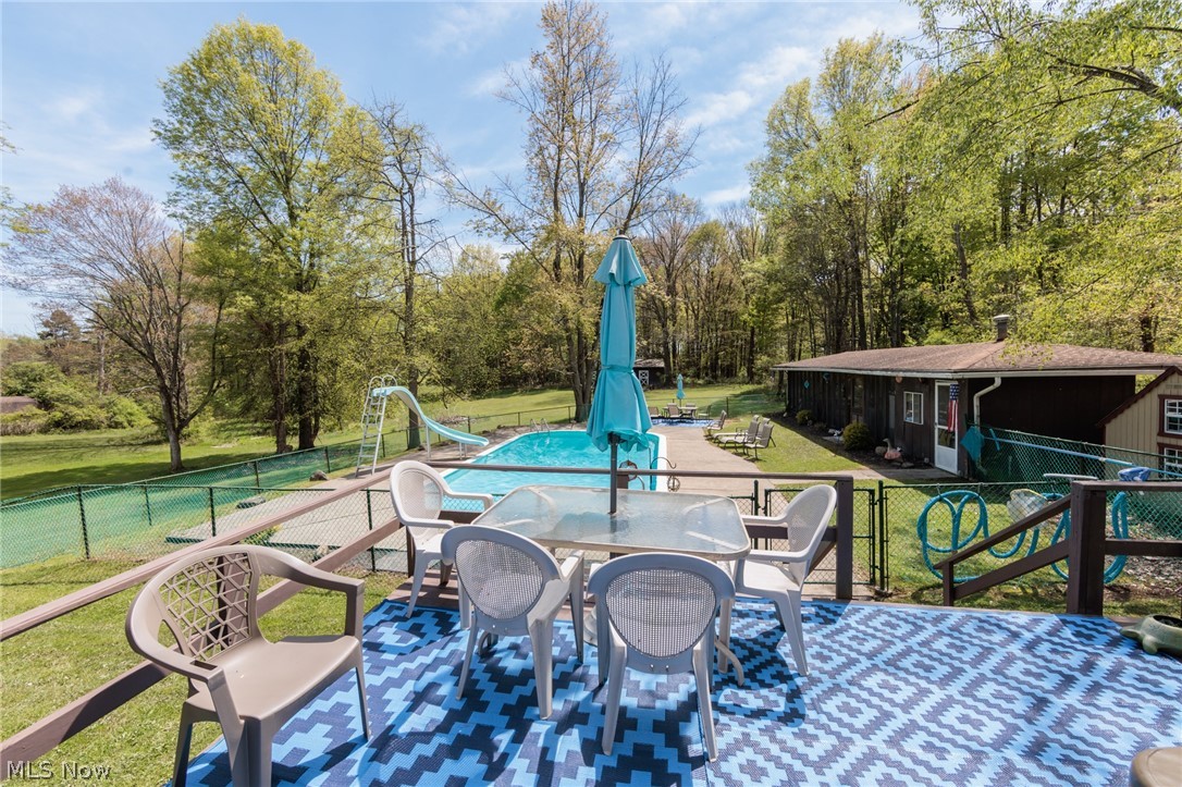 2170 Norton Road Stow, OH 44224 - Photo 9 of 48 Raised outdoor deck with a patterned blue and white rug