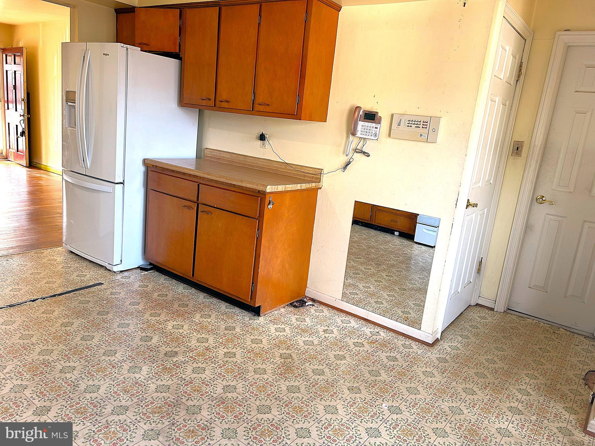 13105 Imperial Court Laurel, MD 20708 - Photo 9 of 13 a kitchen with stainless steel appliances a refrigerator and a stove