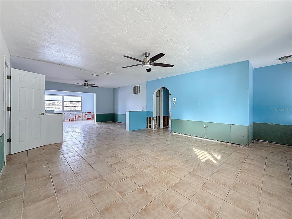 4869 Shell Stream Boulevard New Port Richey, FL 34652 - Photo 16 of 46 a view of a livingroom with a ceiling fan and window