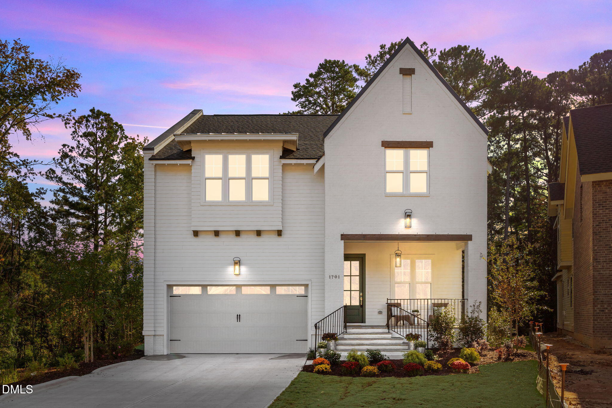 1701 Burnette Gdn Path Raleigh, NC 27612 - Photo 1 of 49 a front view of a house with a yard