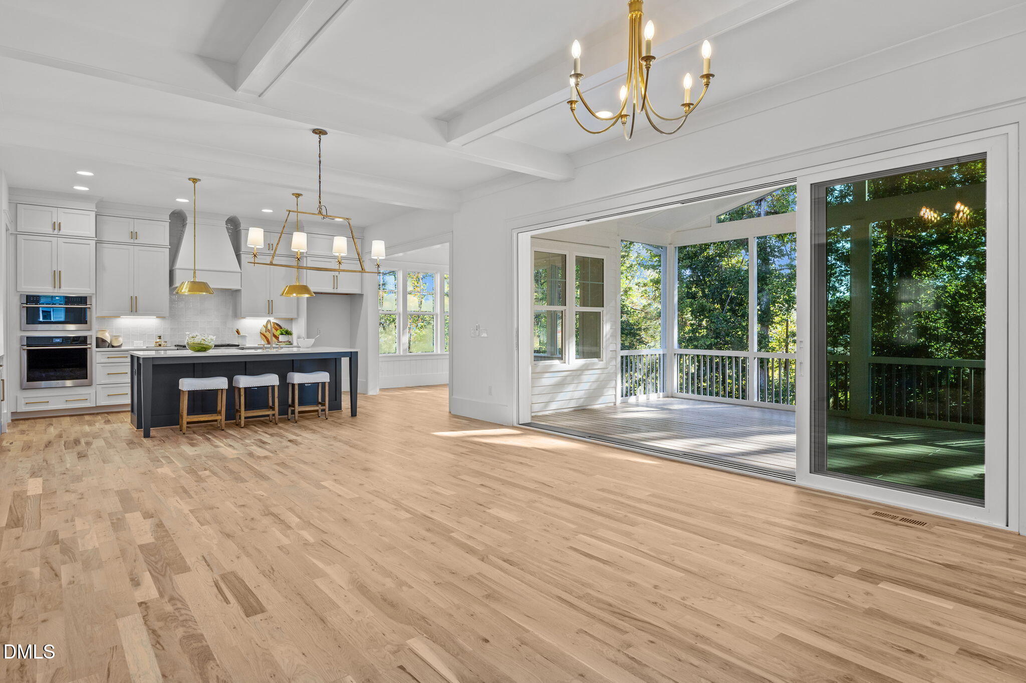 1701 Burnette Gdn Path Raleigh, NC 27612 - Photo 15 of 49 a view of a room with furniture large windows and wooden floor