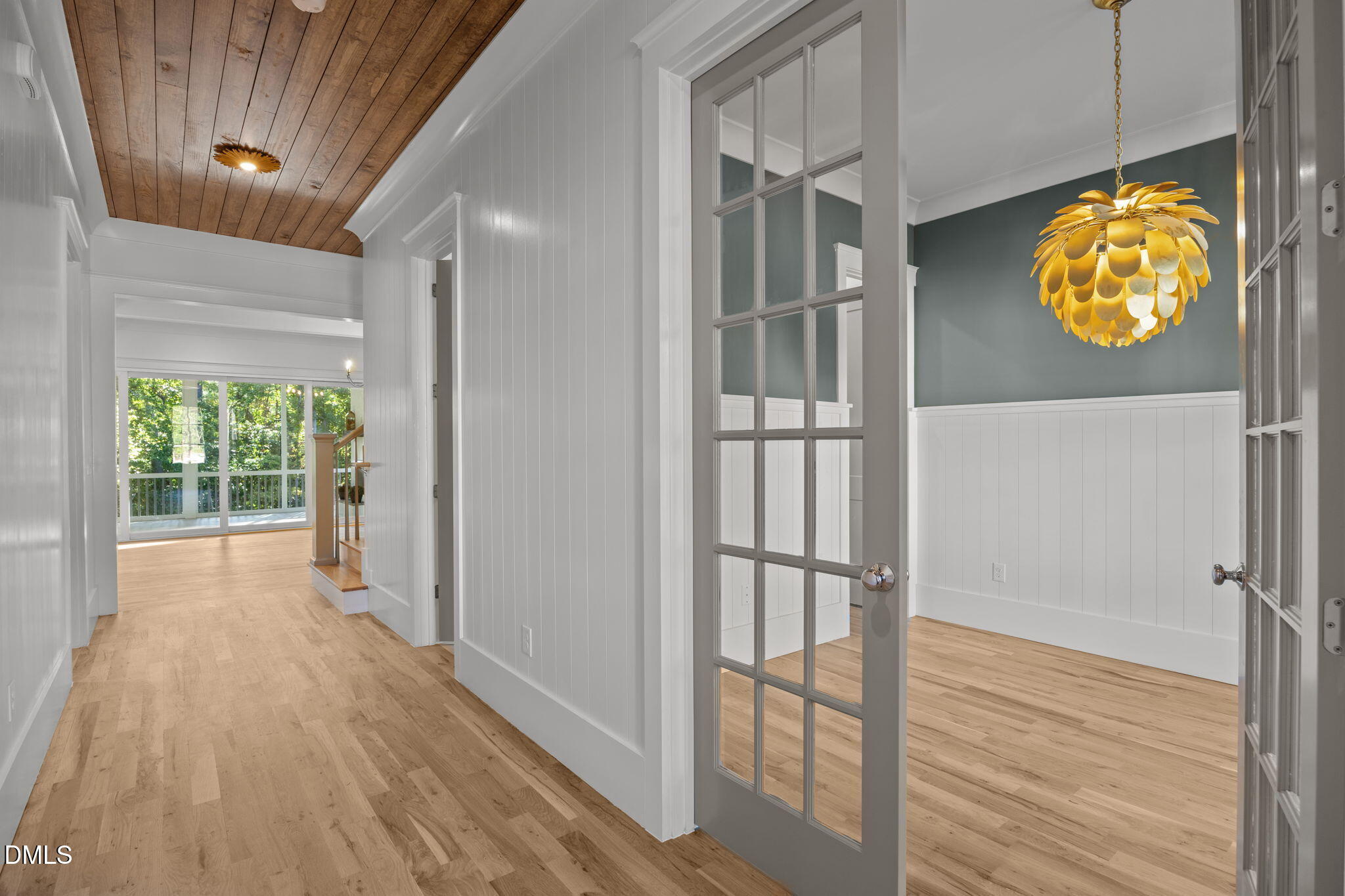 1701 Burnette Gdn Path Raleigh, NC 27612 - Photo 24 of 49 a view of a hallway with wooden floor and a window