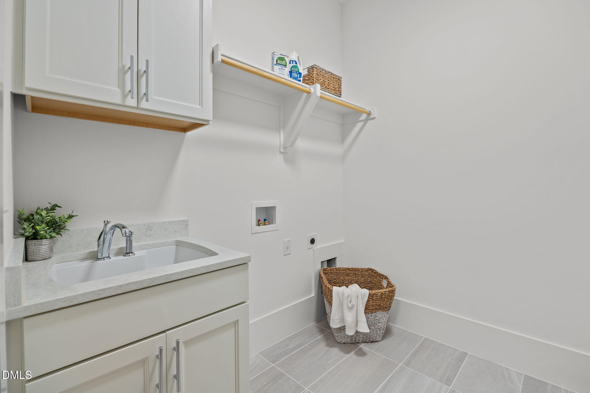 1701 Burnette Gdn Path Raleigh, NC 27612 - Photo 40 of 49 a bathroom with a sink and a mirror
