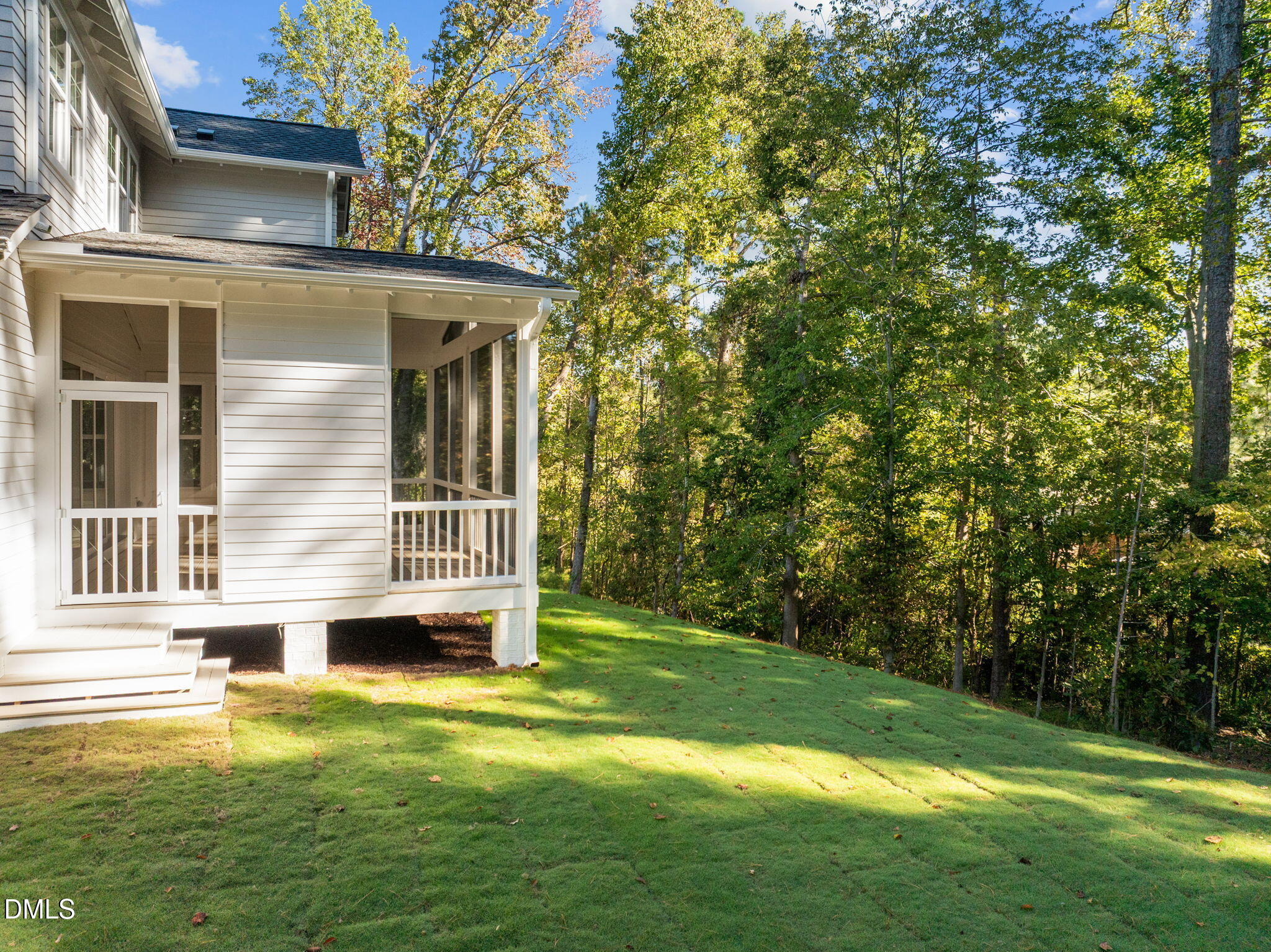 1701 Burnette Gdn Path Raleigh, NC 27612 - Photo 44 of 49 a view of a house with a backyard