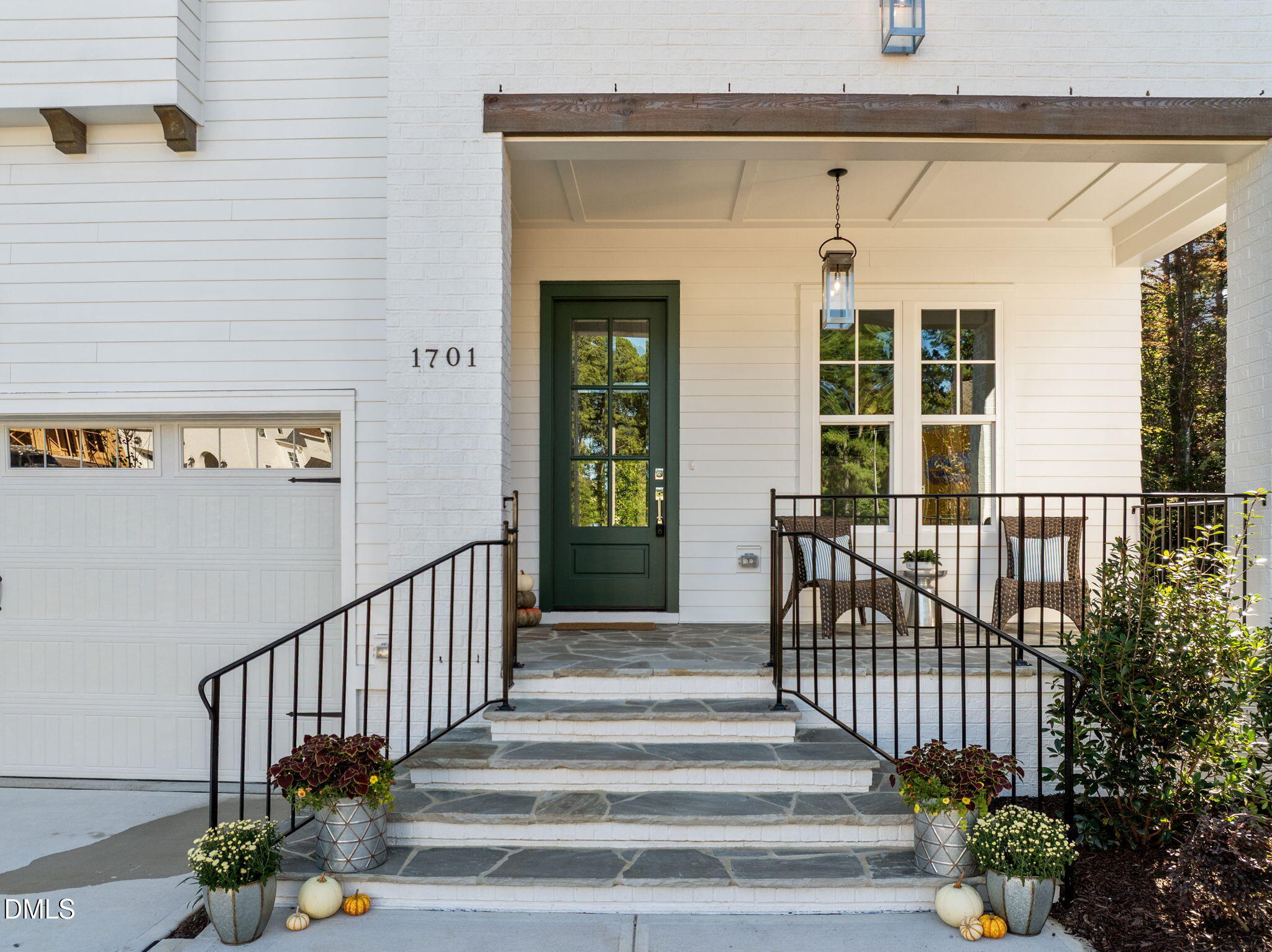 1701 Burnette Gdn Path Raleigh, NC 27612 - Photo 4 of 49 a view of a porch with a bench