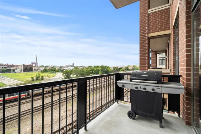 a view of a balcony with chairs