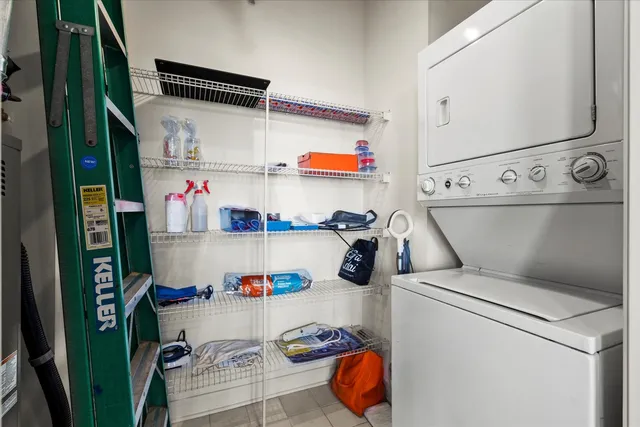 storage and utility room with washer and dryer