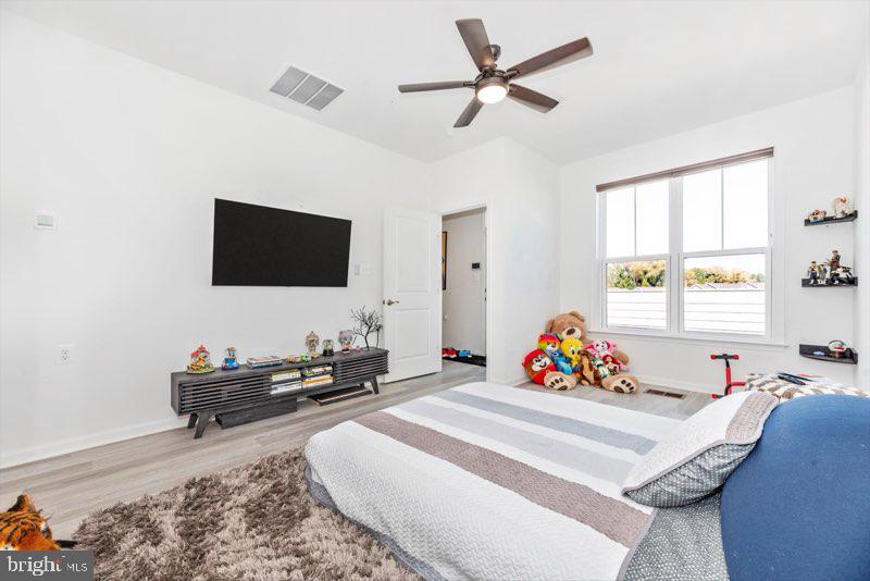 952 Holden Road Frederick, MD 21701 - Photo 13 of 20 a living room with furniture and a flat screen tv