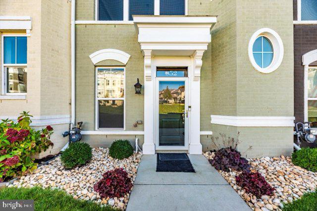 952 Holden Road Frederick, MD 21701 - Photo 3 of 20 a front view of a house with a garden