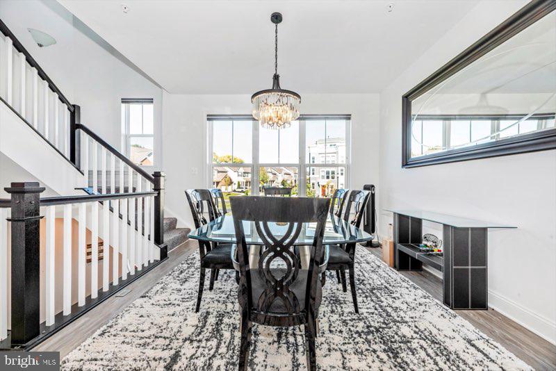 952 Holden Road Frederick, MD 21701 - Photo 9 of 20 a view of a dining room with furniture window and wooden floor