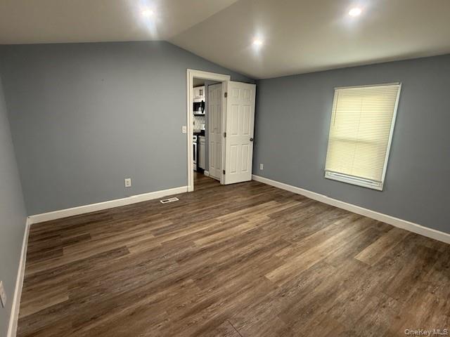 567 Sheafe Road, Unit 10 Wappingers Falls, NY 12590 - Photo 12 of 21 an empty room with wooden floor and windows