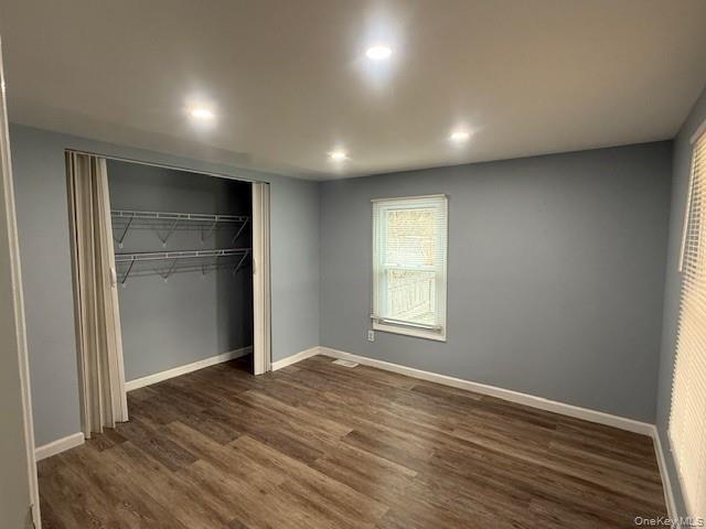 567 Sheafe Road, Unit 10 Wappingers Falls, NY 12590 - Photo 17 of 21 a view of an empty room with wooden floor and a window