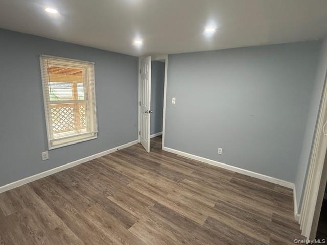 567 Sheafe Road, Unit 10 Wappingers Falls, NY 12590 - Photo 18 of 21 an empty room with wooden floor and windows