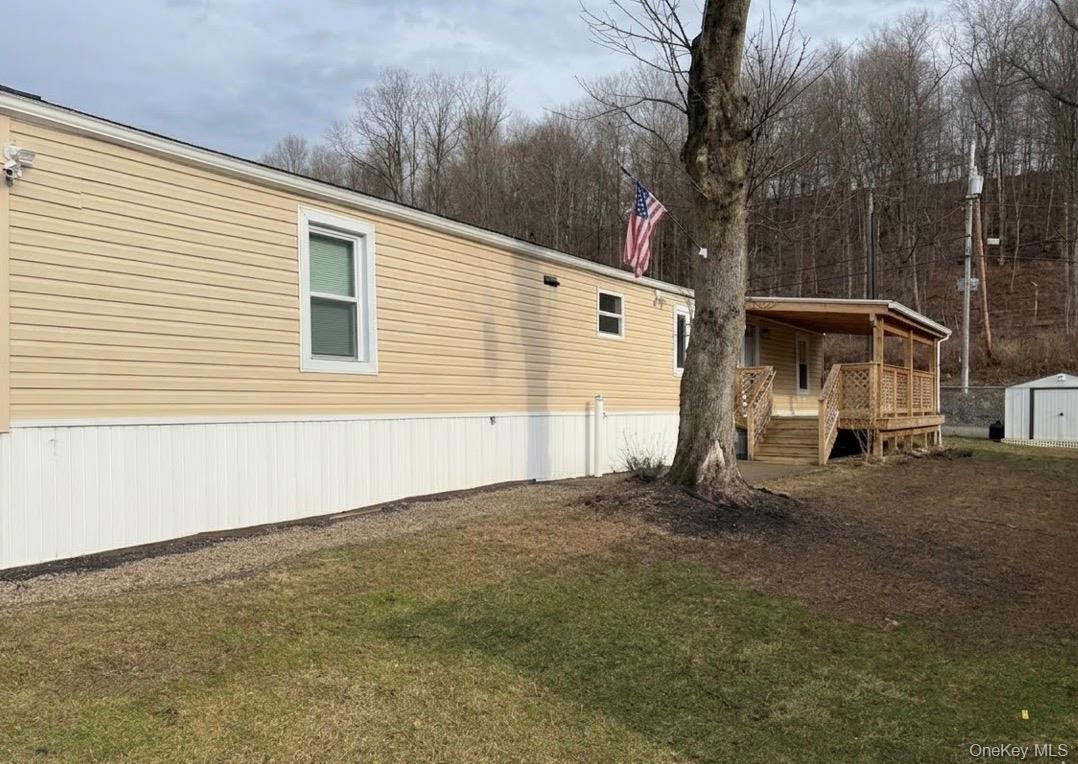 567 Sheafe Road, Unit 10 Wappingers Falls, NY 12590 - Photo 2 of 21 a backyard of a house with lots of green space