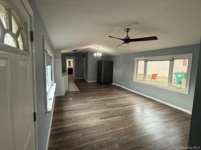 567 Sheafe Road, Unit 10 Wappingers Falls, NY 12590 - Photo 6 of 21 a view of a hallway with wooden floor and a chandelier