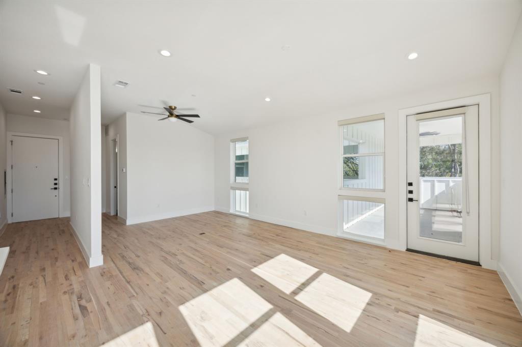 4907 Bryan Street Dallas, TX 75204 - Photo 16 of 21 wooden floor in an empty room with a window