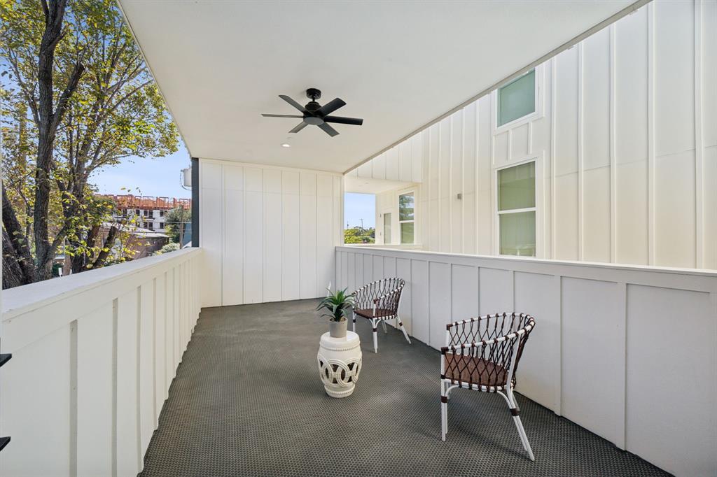 4907 Bryan Street Dallas, TX 75204 - Photo 7 of 21 a view of a chairs and table in a balcony