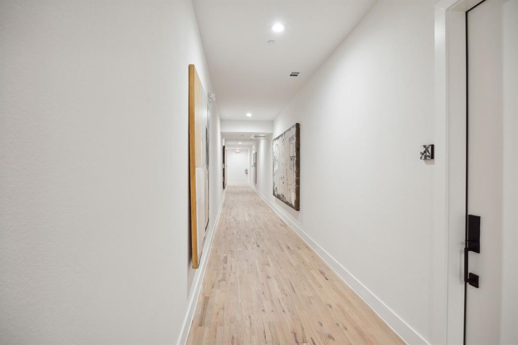 4907 Bryan Street Dallas, TX 75204 - Photo 8 of 21 a view of hallway with wooden floor