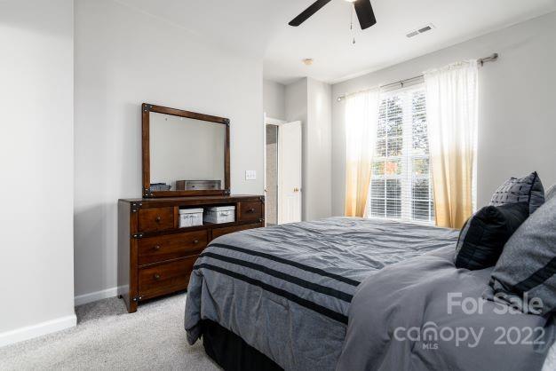 903 Azurine Circle Fort Mill, SC 29708 - Photo 12 of 19 a bedroom with a bed and a window