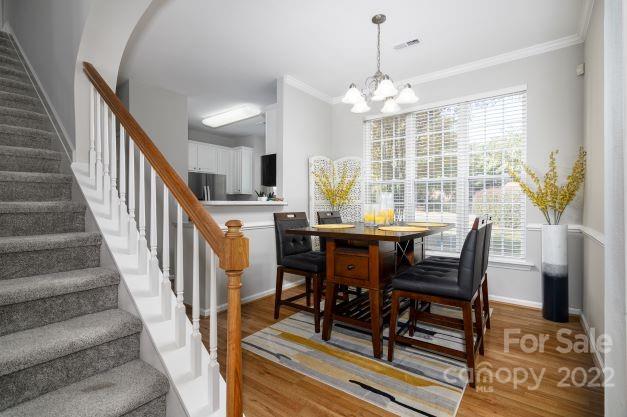 903 Azurine Circle Fort Mill, SC 29708 - Photo 7 of 19 a view of a dining room with furniture window and wooden floor