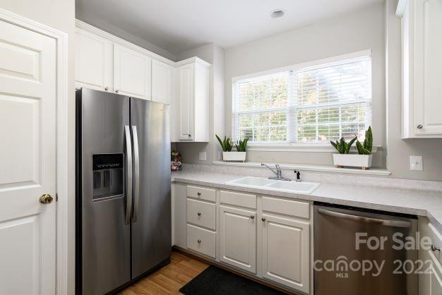 903 Azurine Circle Fort Mill, SC 29708 - Photo 10 of 19 a kitchen with stainless steel appliances a refrigerator sink and cabinets