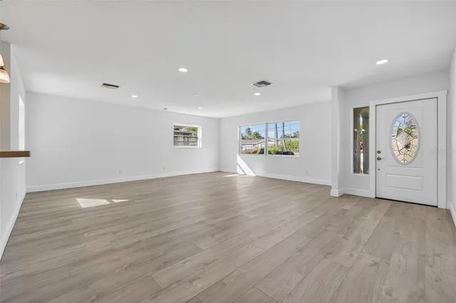 wooden floor in an empty room with window