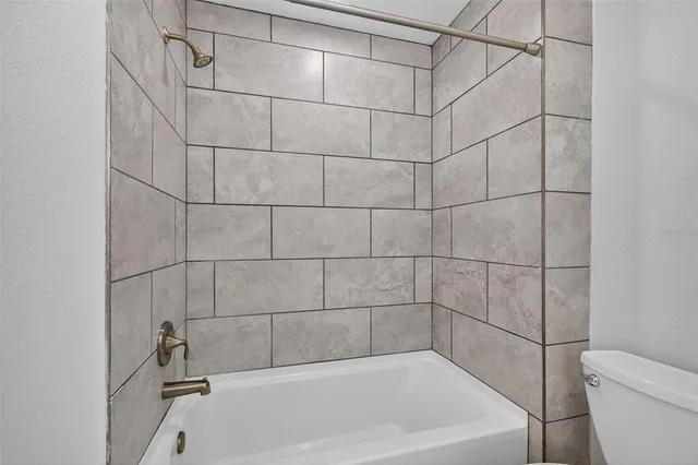 a bathroom with a bath tub