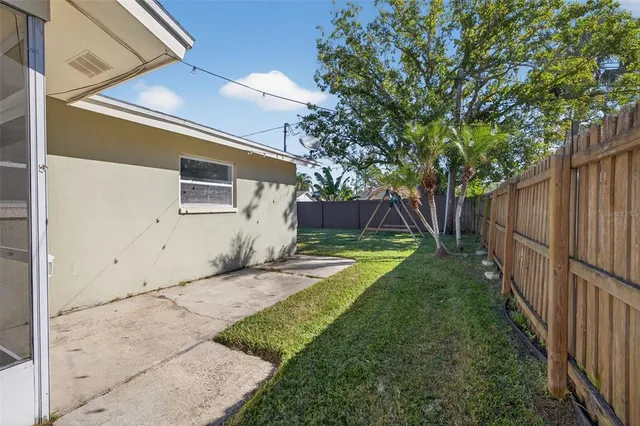 a view of a back yard of the house