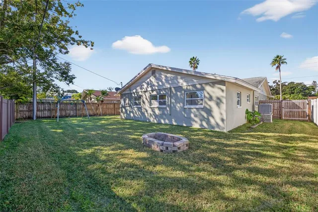 a backyard of a house with lots of green space