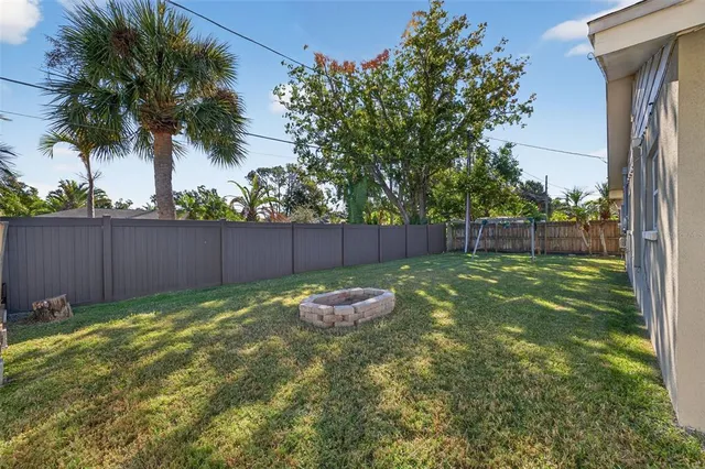 a backyard of a house with lots of green space