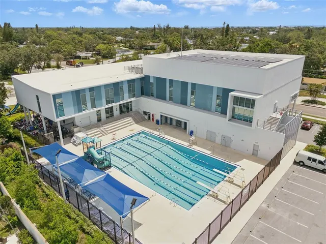 an aerial view of a house with a ocean view
